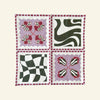A quilt of four squares features abstract patterns in pink, green, and white on a light background, reminiscent of The Poppy Tile Venice Napkin design by Good Juju Homeware.