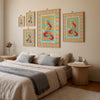 Bedroom with colorful wall art and a bed with gray and beige bedding.