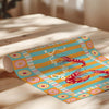 Colorful decorative paper with lobster design on a wooden surface