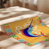 Colorful placemat with fish design and text on a wooden surface