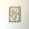 Decorative wall art with colorful shell illustrations and text on a white background