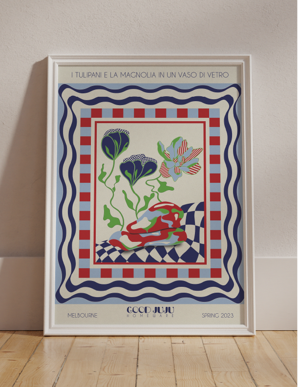 A framed poster featuring the Tulips and Magnolias Flowers in a Glass Vase Wall Art in Milan on Good Juju Homewares.