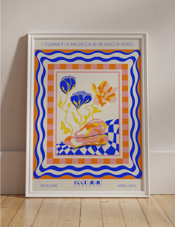 A framed poster featuring the Tulips and Magnolias Flowers in a Glass Vase Wall Art in Capri on Good Juju Homewares.