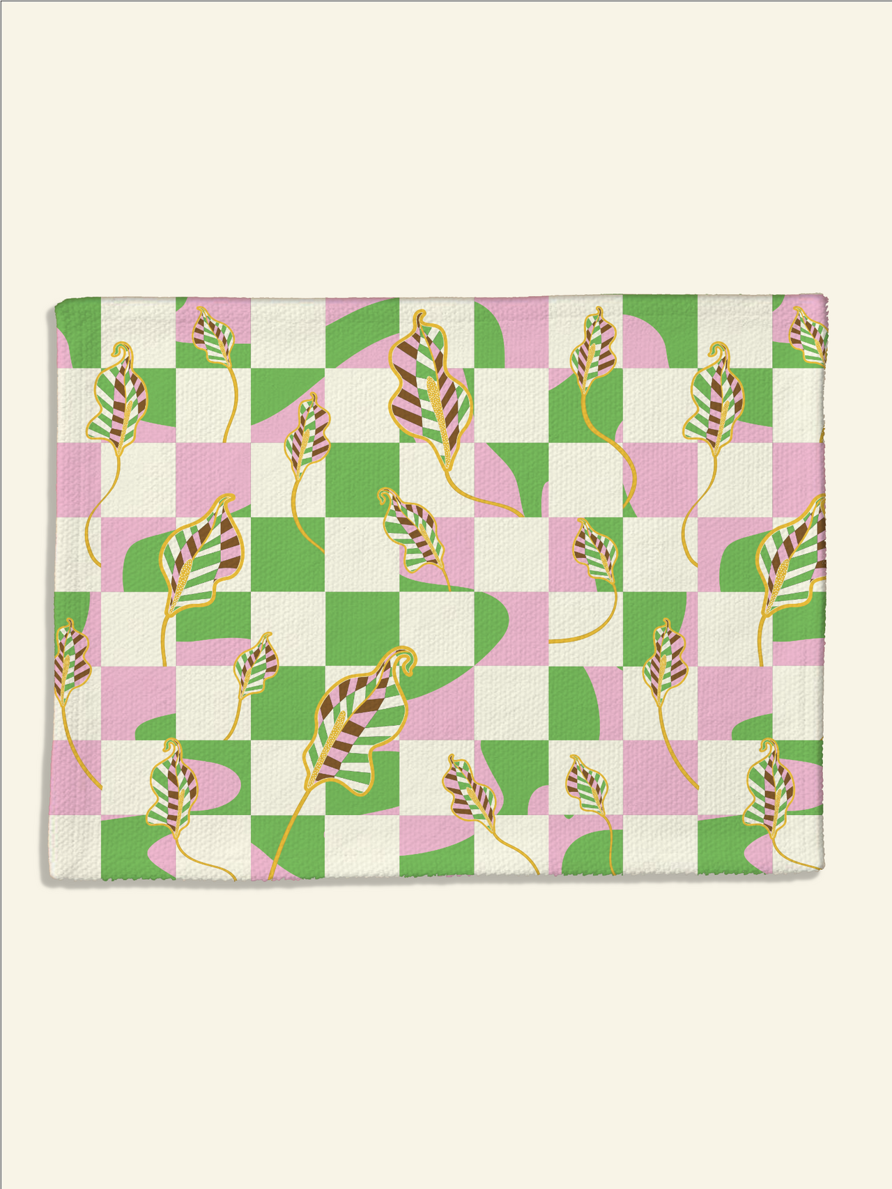 A pink and green Checkered Calla Lilly Placemat | Florence with leaves on it by Good Juju Homeware.