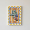 Decorative wall art with 'IL FICO' branding on a plain background