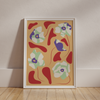 The framed artwork "Poppies All Around Rome Wall Art" by Good Juju Homeware features red shapes and richly hued florals, with white flowers showcasing green and purple centers. It leans against a light wall on a wooden floor, infusing the space with charm.