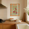 Kitchen interior with a colorful abstract painting on the wall, wooden countertop, and window.