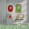 Decor featuring Good Juju Homeware's Framed Magnolia Florence Wall Art, a checkered cube table with an orange lamp, and a yellow chair on a green and white wavy patterned rug exuding nature-inspired sophistication.