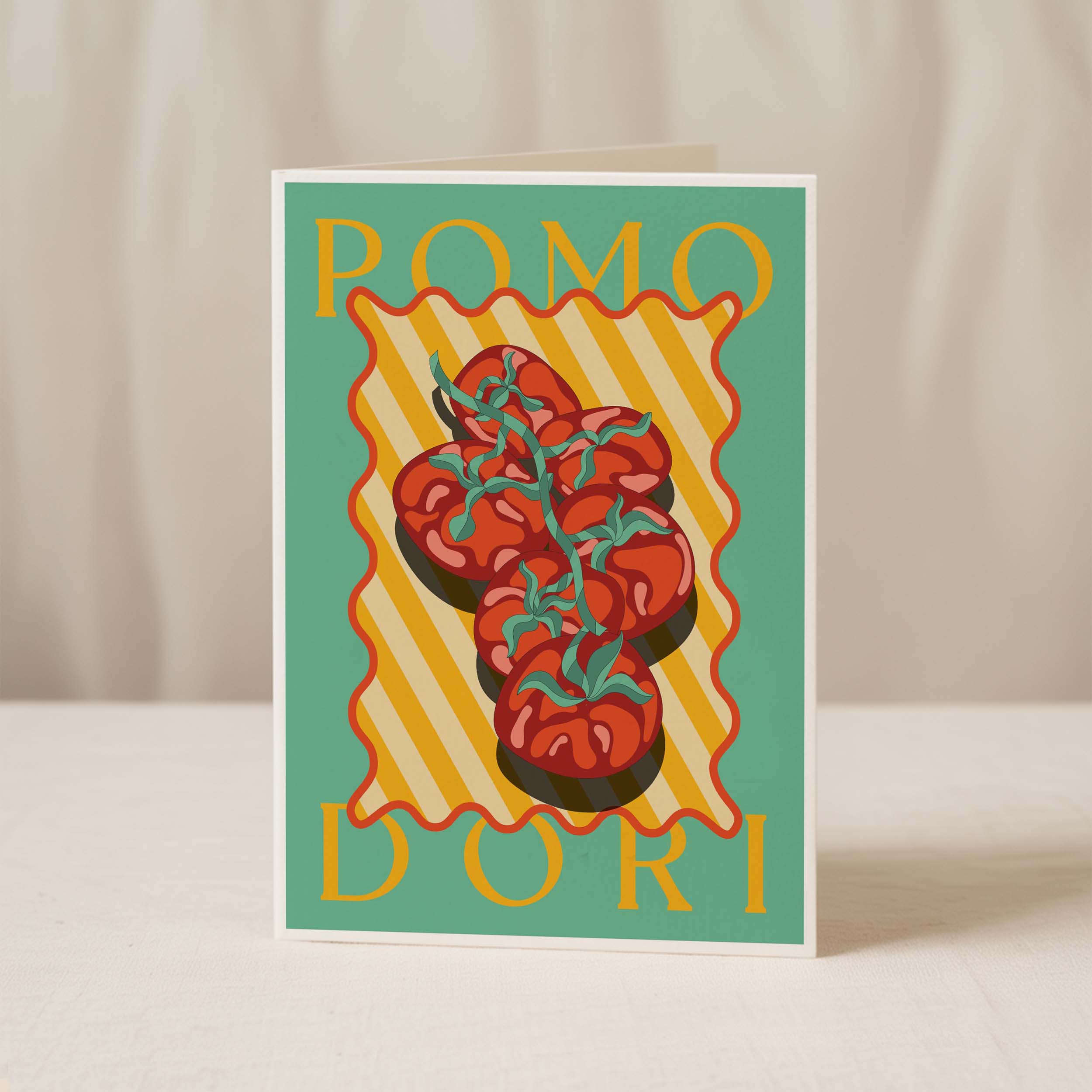 Greeting card standing upright featuring an illustration of a zuchini on a yellow striped background, with "ZUCHINI" in bold text—crafted on premium card stock by Good Juju Homeware for extra Mediterranean flair.