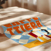 Colorful graphic design paper with geometric patterns on a wooden surface